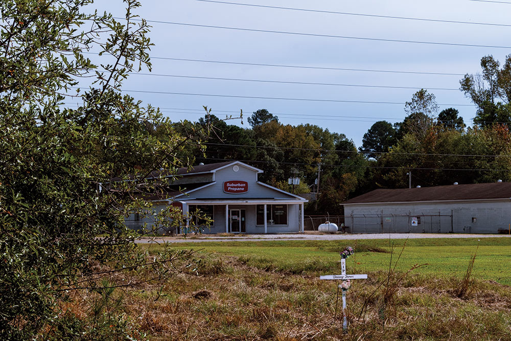 white cross with Suburban Propane building seen in background