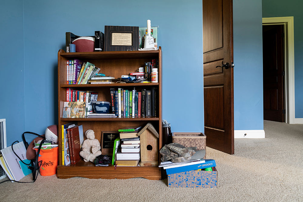 full bookshelf in blue room