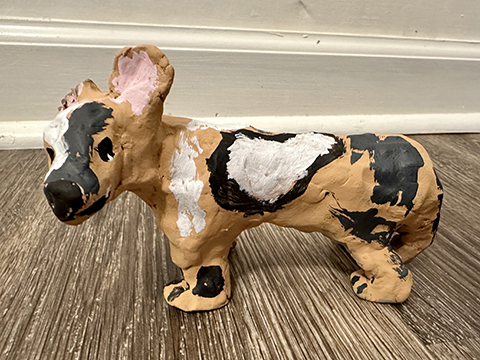 Clay sculpture of an African Wild Dog.