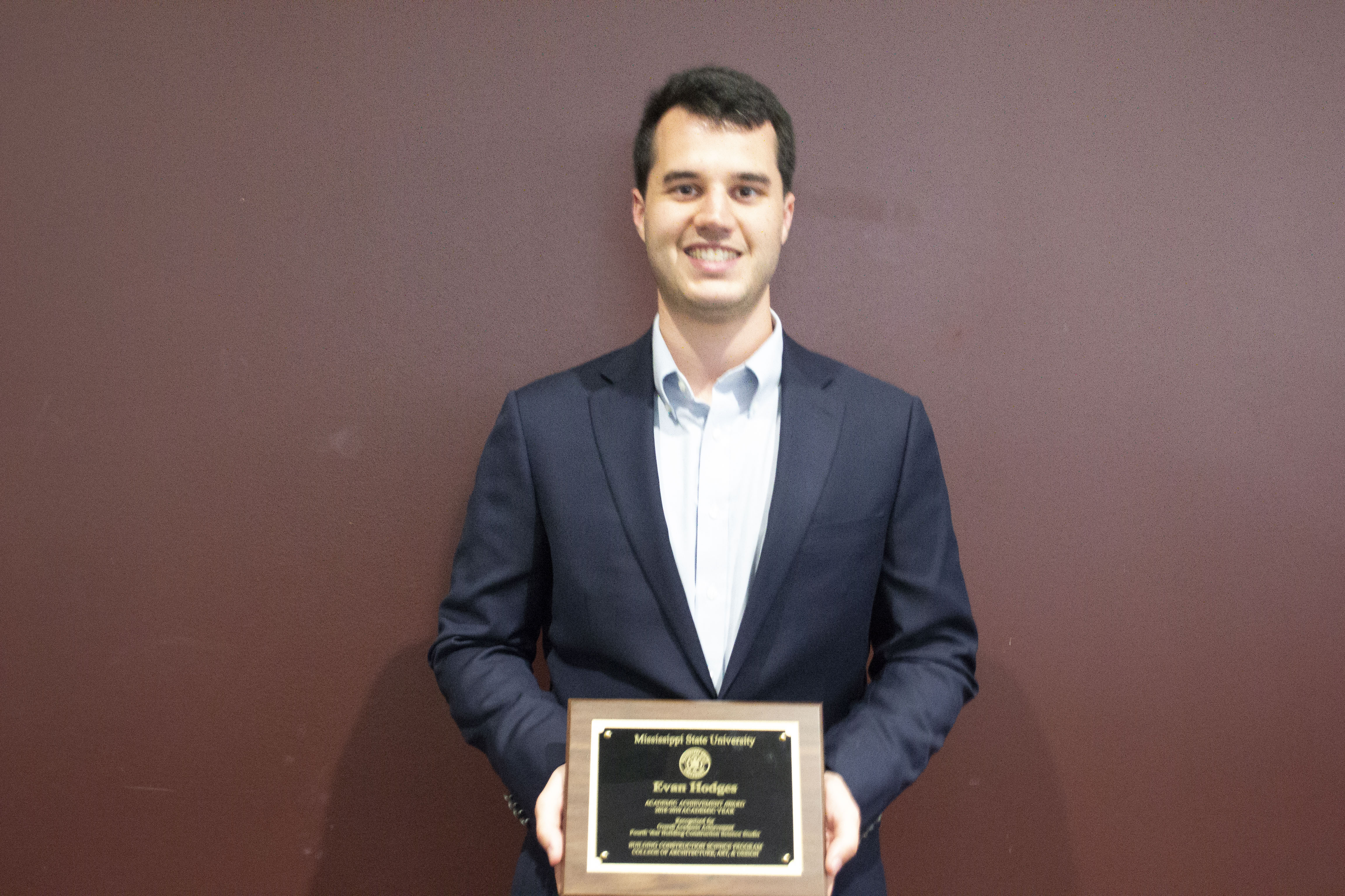 Evan Hodges with his fourth-year Mississippi State University Building Construction Science Student of the Year Award