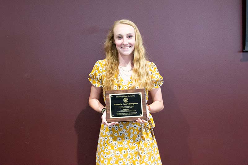 Victoria Thompson with her third-year Mississippi State University Building Construction Science Student of the Year Award