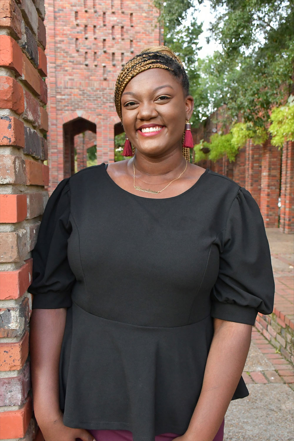 Chrissy Hoof poses in front of the Chapel of Memories on campus at Mississippi State