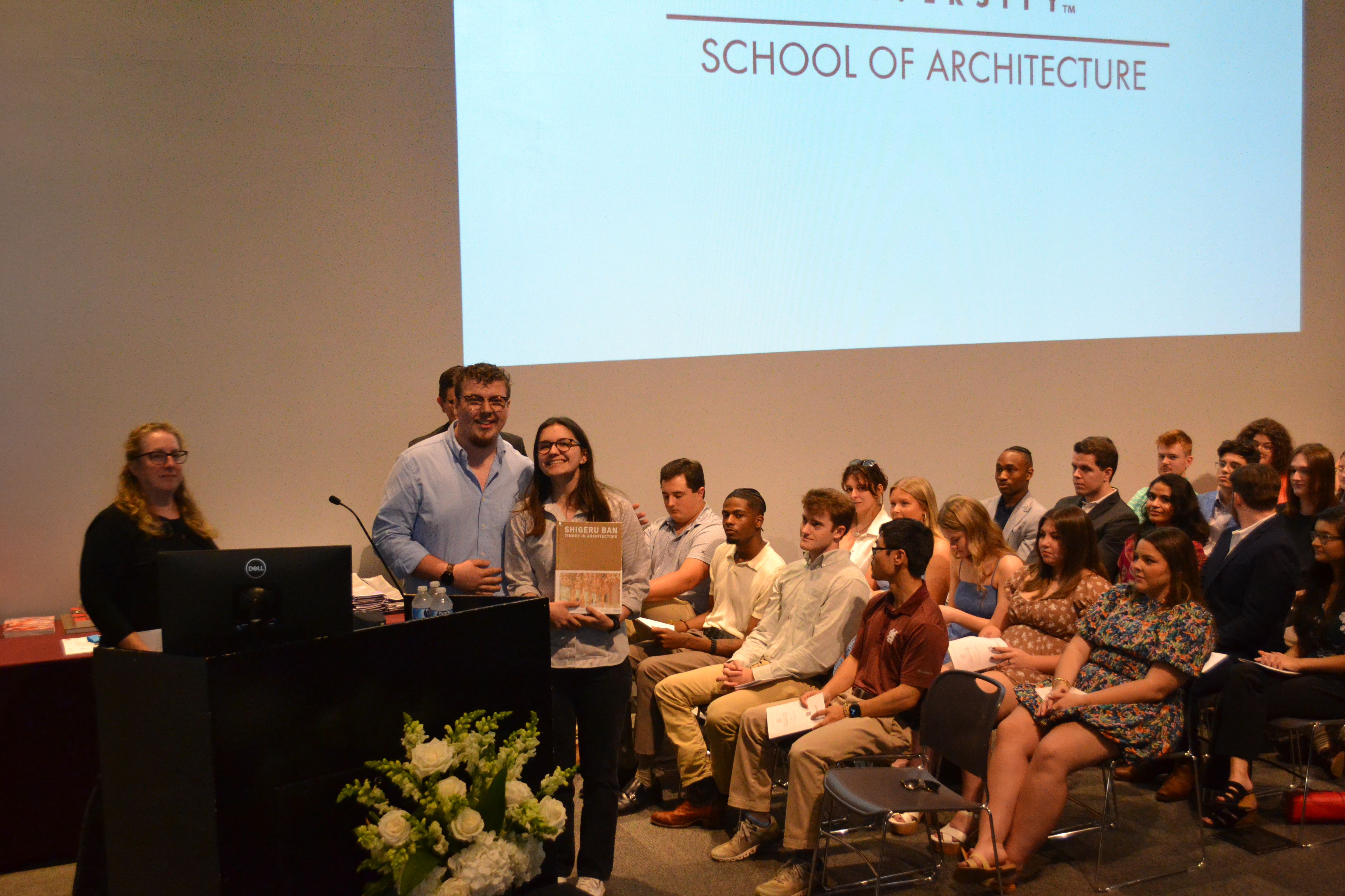 Noah Bates, left, poses with AIAS award recipient Kathryn Stewart