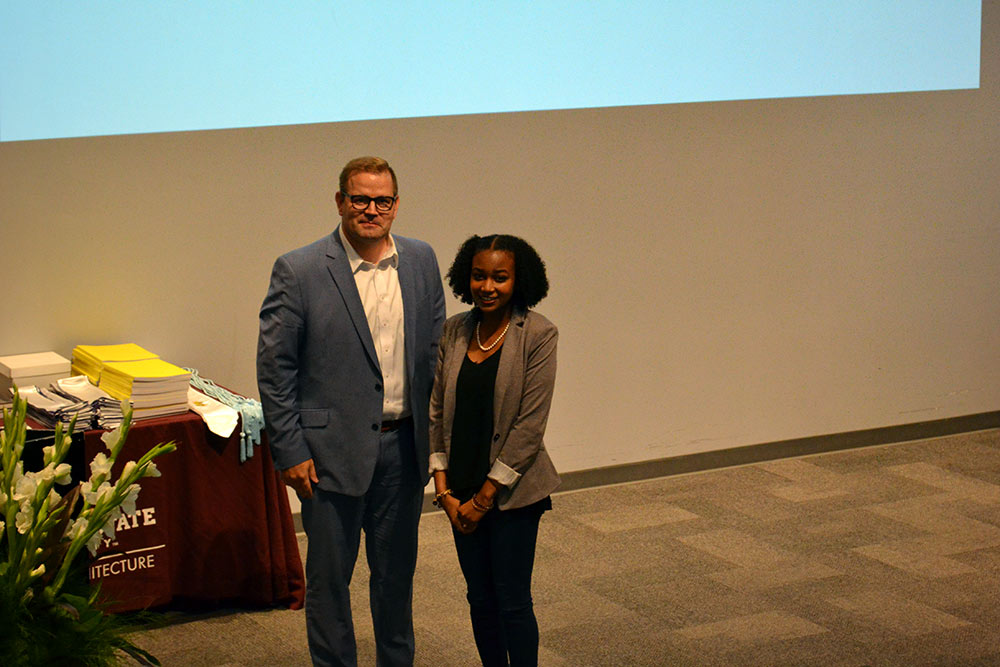 Professor Jake Gines, left, stands with Alysia Williams