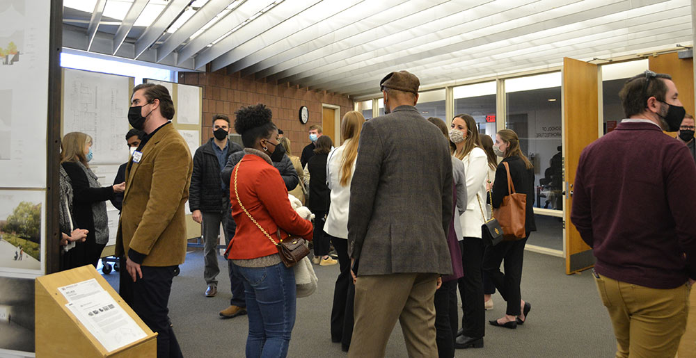 people gathered for reception in the Charlotte and Richard McNeel Gallery