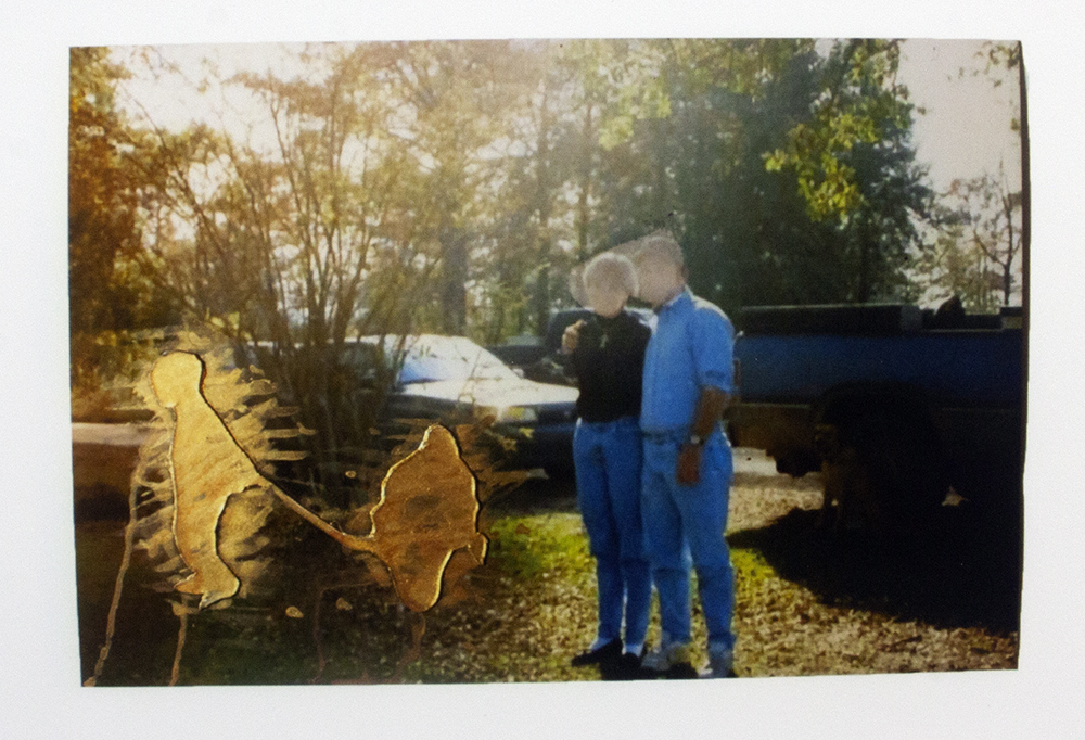 A photograph of what seems to be like two people looking at something that does not exist