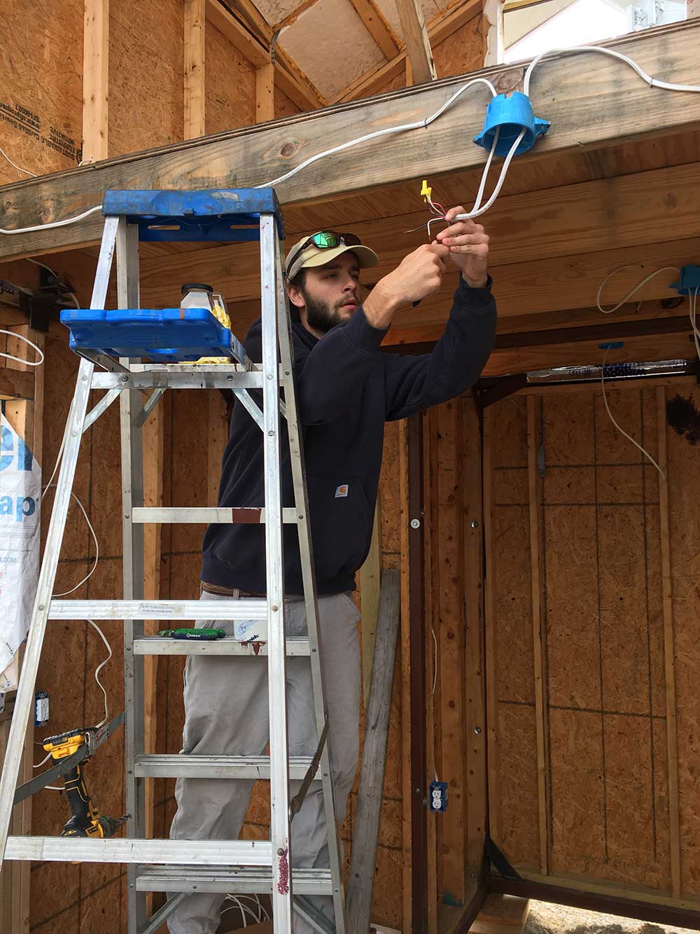 Mississippi State students in BCS 3212 Electrical Systems wired a tiny house built by first-year students