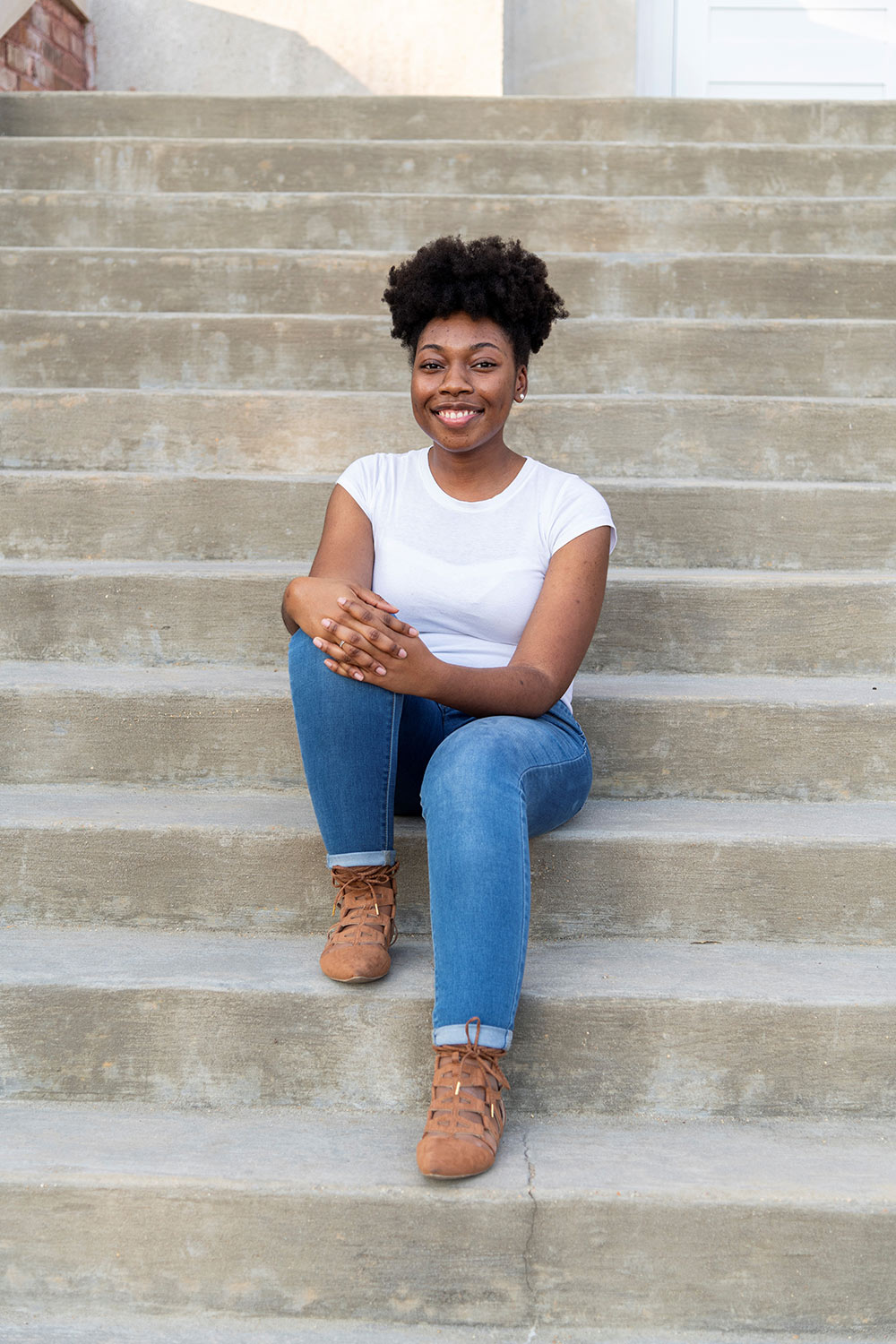 Allyson Parker sits on steps