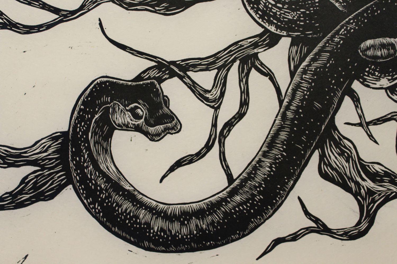 wood cut print of a snake