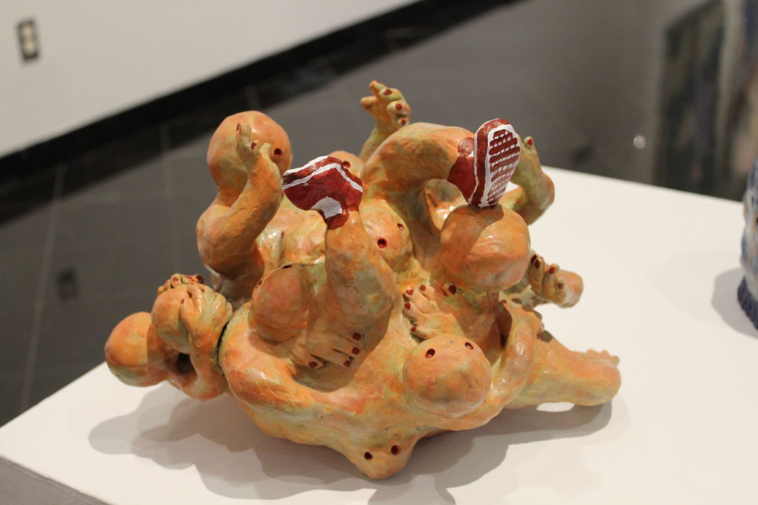 wideshot of a ceramic piece of a group of people bundled up