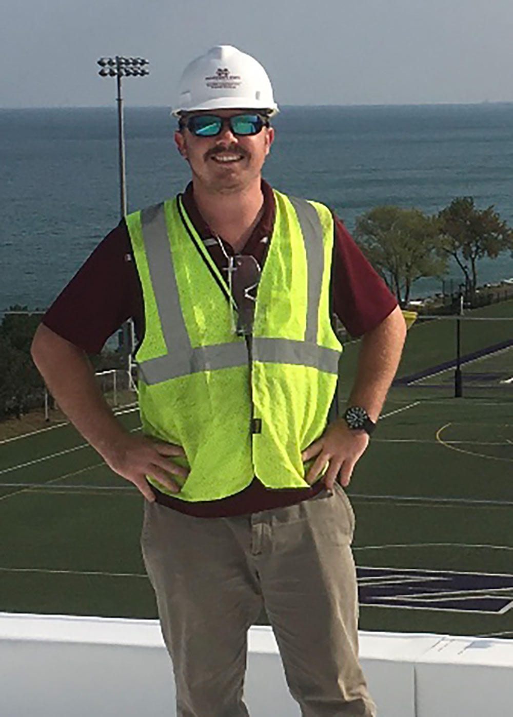 William Young poses in construction PPE